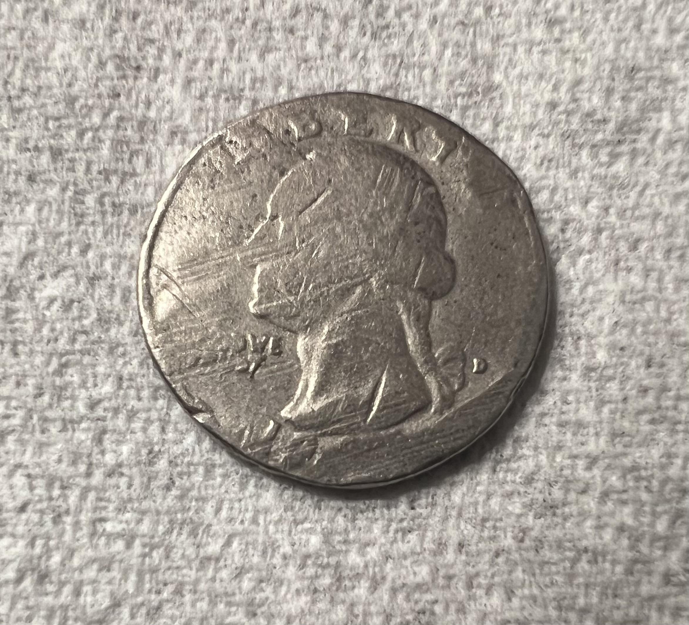 1959 quarter clipped planchet error showing curved missing section along coin edge and Blakesley effect on opposite rim